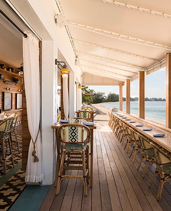 coccoloba outdoor restaurant seating with ocean views on the beach